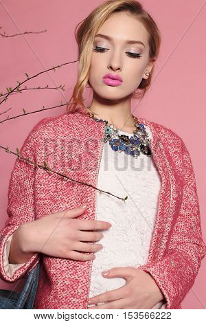 fashion studio photo of gorgeous young woman with blond hair in elegant clothes with acccessories
