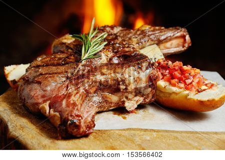 delicious piece of meat roasted on a background of fire