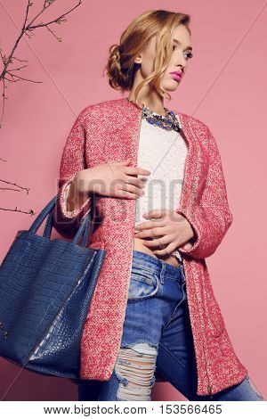 fashion studio photo of gorgeous young woman with blond hair in elegant clothes with acccessories
