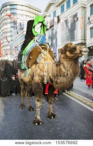 Istanbul Turkey - October 11 2016: Representation on the camels to revive Karbala in the seventh century takes part in an Ashura parade. Turkish Shia Muslims mourning for Imam Hussain. Caferis take part in a mourning procession marking the day of Ashura i
