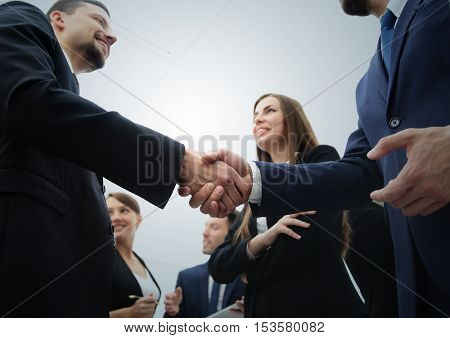 Business handshake. Business handshake and business people conce