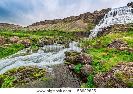 Waterfall Flowing Into A Valley In Iceland