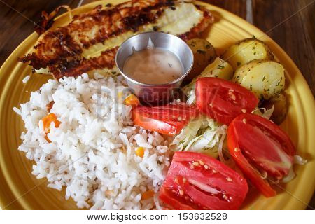 fish served on plate with vegetables nicaragua cuisine