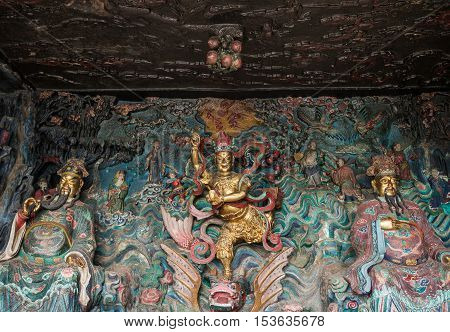 Statue of Kuixing god of fate at western hills, Yunnan, China