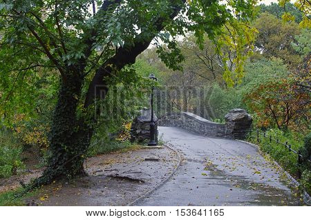 Gapstow Bridge is one of the icons of Central Park Manhattan in New York City during rain storm