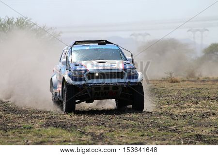 Speeding White And Blue Ford Ranger Rally Car Front View
