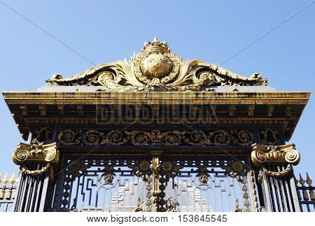 Golden decoration on main gate of Palace of Justice (Palais de Justice) in Paris France