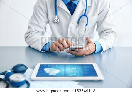 Cardiologist working at office. Health care concept.