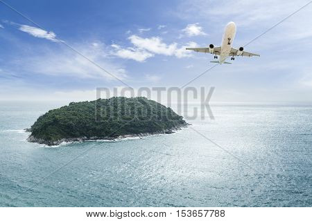 passenger plane flying with beautiful tropical island
