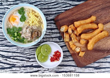 Rice porridge with mined pork and chicken lever with Patongko (deep-fried dough stick)