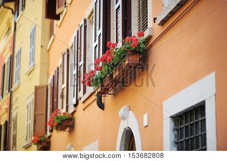 A colorful balcony in Italian town on summer day