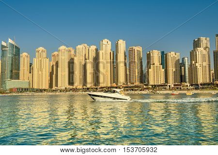 DUBAI, UAE - OCTOBER 09, 2016. View of various skyscrapers in Jumeirah Beach Residence (JBR) with stunning turquoise waters as foreground
