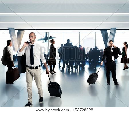 Busy businesspeople waiting at the airport for their flight