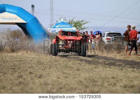 Speeding Orange Bat Rally Car At Start Of Race