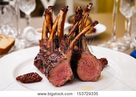 Lamb rack with limoncello glaze served on a plate