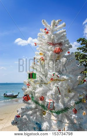 Ao Nang beach Thailand - December 25 2012: Christmas tree in front of Ao Nang beach on Christmas Day in Krabi Province southern Thailand