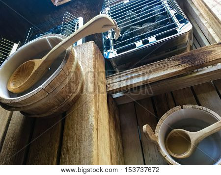Sauna buckets and ladles with water in relaxing Nordic sauna health and wellness. pampering activity and healthy lifestyle