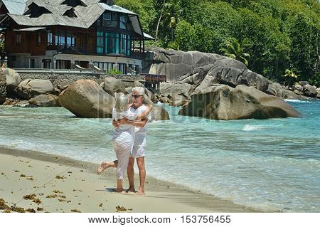 Happy elderly couple rest at tropical beac