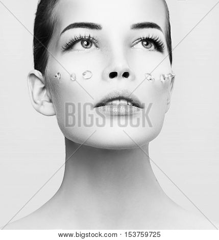 Fashion Beautiful Woman With Drops Of Gel On Another Cheek