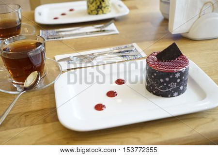 glass tea kettle with Turkish and Oriental sweets on the table