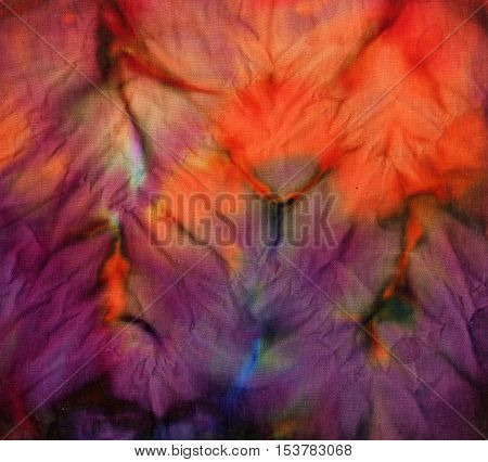 Tie dye pattern abstract background. Red and purple colors