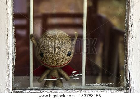 Halloween concept, little cute devil toy with trident