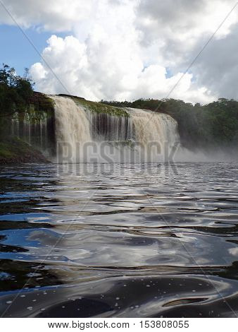 Waterfall axe. waterfall falling on the Canaima Lagoon, in the great Venezuelan Sabana