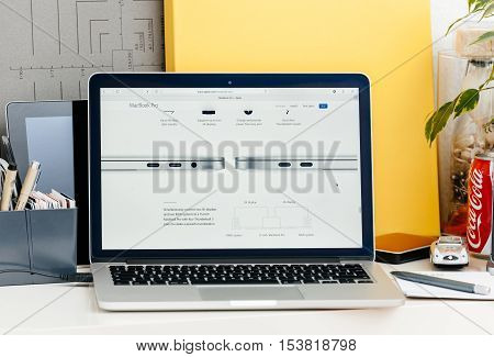 PARIS FRANCE - OCT 28 2016: Apple Computers website on new MacBook Pro Retina with OLED touch bar in a geek creative room showcasing new professional laptop - detail of thunderbolt 3 specification speed bandwith