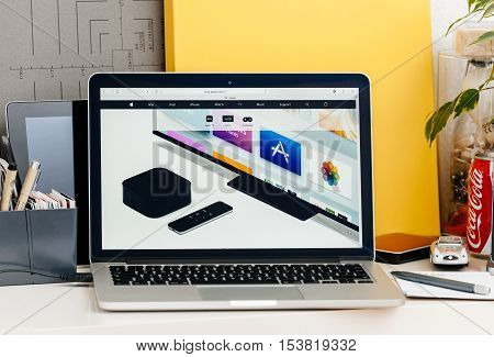 PARIS FRANCE - OCT 28 2016: Apple Computers website on new MacBook Pro Retina with OLED touch bar in a geek creative room showcasing the new TV app from apple