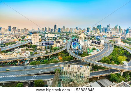 BANGKOK THAILAND - 16 APRIL 2016 - Wide angle scene of Bangkok elevated expressway and high-rise buildings in the evening light.