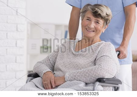 Smiled Senior Woman With Her Caregiver