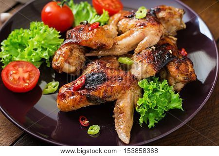 Baked Chicken Wings In The Asian Style On Plate.