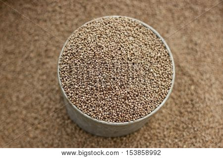 Sesame seeds in can on bag close up view