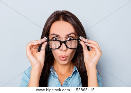 Wow! Shocked Pretty Woman Touching Her Glasses