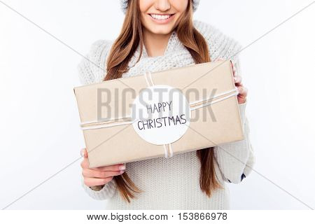 Cheerful Woman  In Warm Hat And Scarf Holding Package And Congratulate With Xmas..