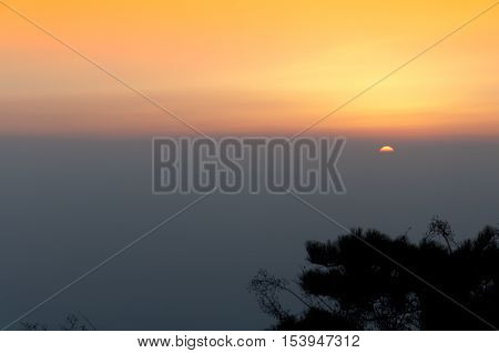 The sun rising over the Taishan Mountain range in Shandong province China.