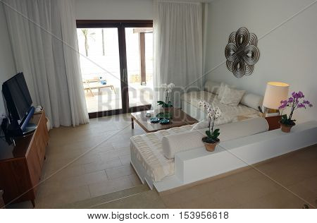 HERAKLION CRETE GREECE - MAY 13 2014: The Interior room with big bed lamps and terrace in modern building of luxury class hotel on the Mediterranean coast of Crete May 13 2014 Greece.