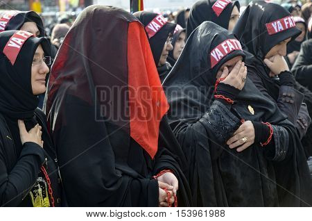 Istanbul Turkey - November 3 2014: Universal Ashura Mourning Ceremony. Day of Ashura. Turkish Shia women mourn during an Ashura procession. A Universal Ashura Mourn Ceremony was held in Istanbul to commemorate the martyrdom of Husain ibn Ali 