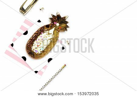 Styled background. Mock-up photo. Fashion and trendy. Flat lay. Stationery items polka dots pattern with pineapple and pencil gold stapler. Header for site hero