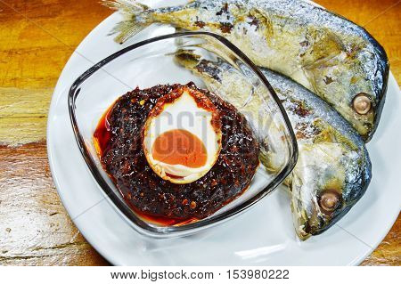 fried mackerel dipping with chili paste topping salt egg on dish