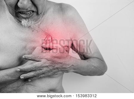 acute pain possible heart attack senior man is clutching he chest with red effect.