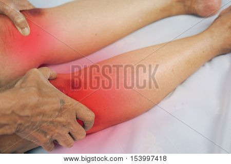 senior man holding he knee on pain area