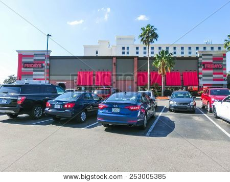 Orlando, Usa - May 8, 2018: Tgi Fridays Exterior And Logo. Tgi Fridays Is An American Restaurant Cha
