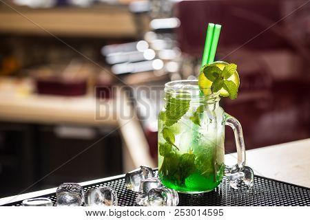 Mojito Drink Or Lemonade With Mint Leaves On Barcounter.