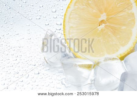 Lemon Ring With Ice On A Silvery Background Closeup