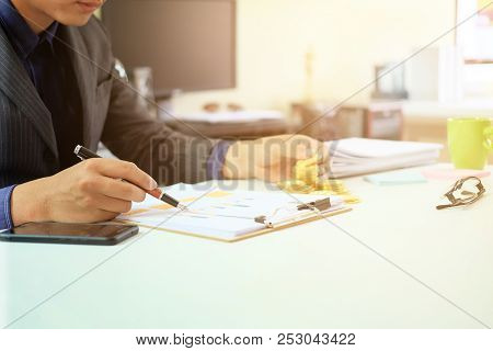 Businessman Working Checklist On Paper Document Finance Concept.