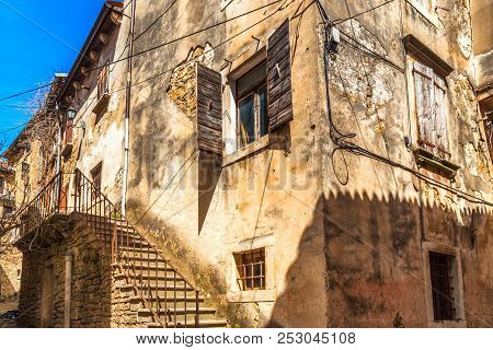 Ancient Houses On A Stone Street In Groznjan Village, Istria, Croatia, Europe.