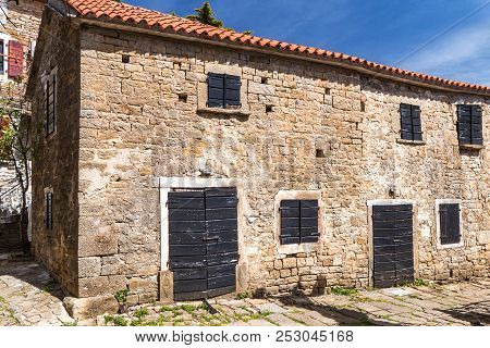 Ancient Houses On A Stone Street In Groznjan Village, Istria, Croatia, Europe.