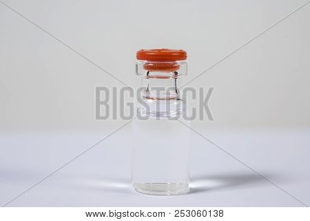 Group Of Vials With Medication On Blue Methacrylate Table. Horizontal Composition.