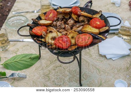 Saj Kebap With Mushrooms Chicken. Outdoor Picnic Table.